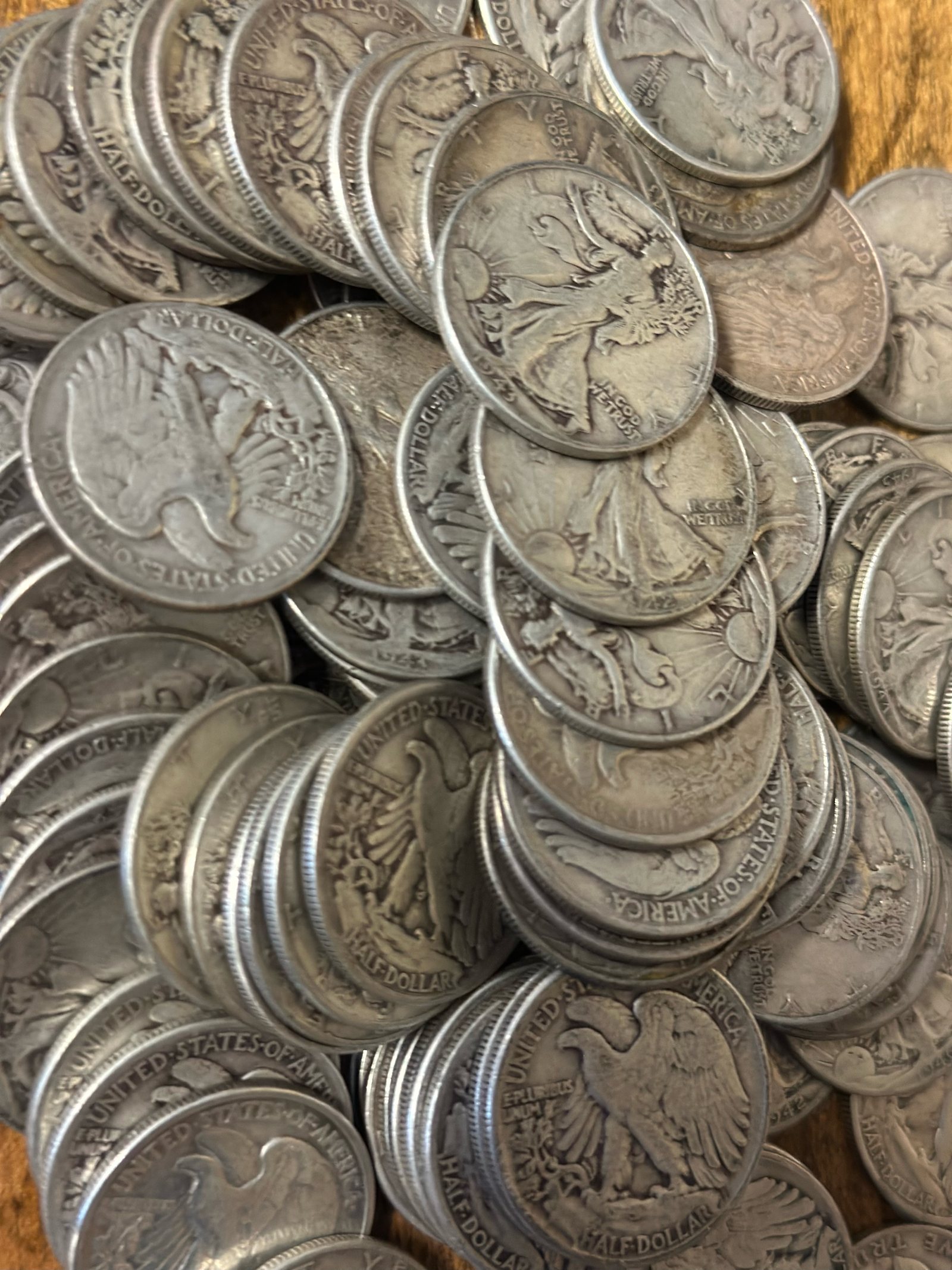 A pile of Walking Liberty silver half dollars